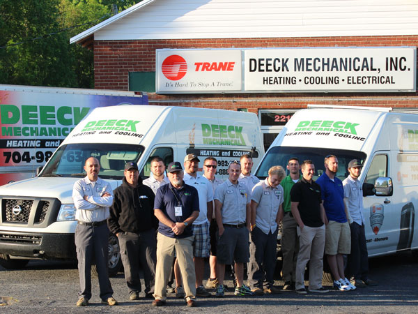 Deeck-Michanical-Office Deeck Mechanical image outside with staff and trucks